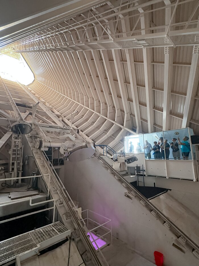 Summer Stars 2025 participants look inside the tunnel of the McMath-Pierce Solar Telescope