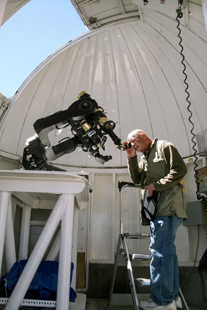 Docent looking through solar telescope